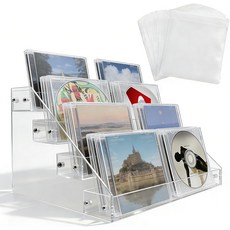 4단 투명 아크릴 캐스케이드 CD 홀더 DVDCD 디스플레이 스탠드 보관함 비닐 레코드 선반. 최대 32개의 표준 케이스를 보관할 수 있으며 20개의 CDDVD 슬리브가 포함되어