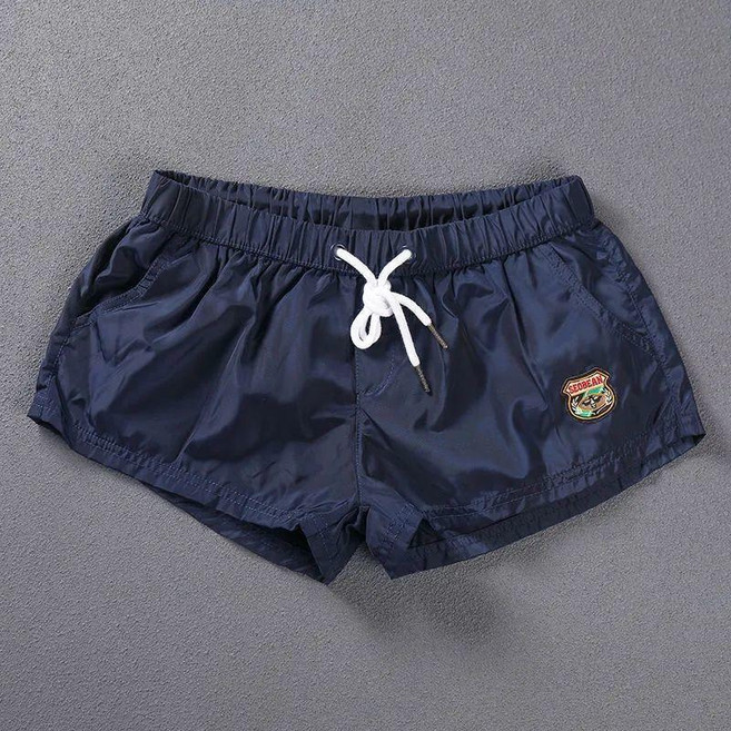 好看沙灘褲男夏速透氣海邊純色大碼速幹運動休閒寬鬆泳褲健身短褲