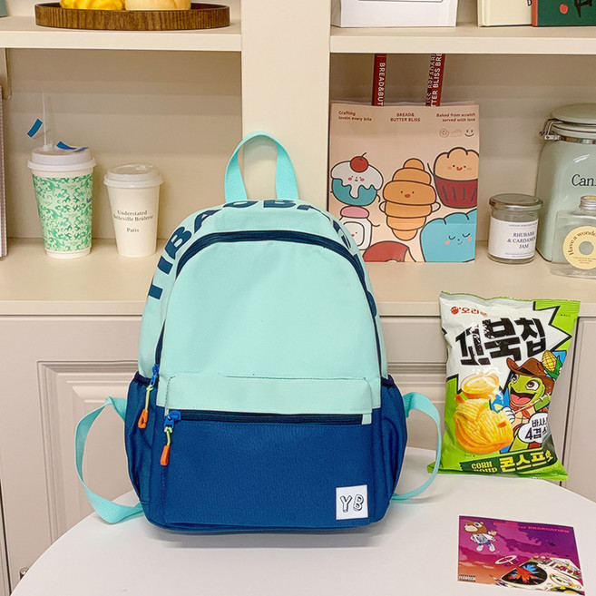 撞色可愛書包兒童女生小學生輕便拼色雙肩包高顏值幼兒園出遊揹包