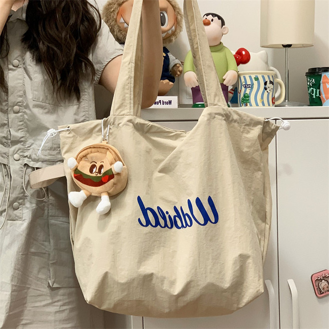 新款鬆弛感帆布包托特包包女抽繩通勤輕便手提袋文藝大容量單肩包