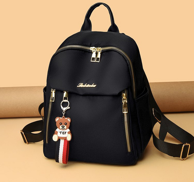 투니스 여성 단색 지퍼 백팩 펜던트 포함